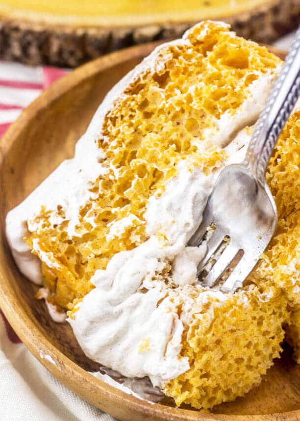 This pumpkin angel food cake has a lightly spiced Cool Whip frosting that complements it perfectly. pumpkin angel food cake with pumpkin spice Cool Whip frosting