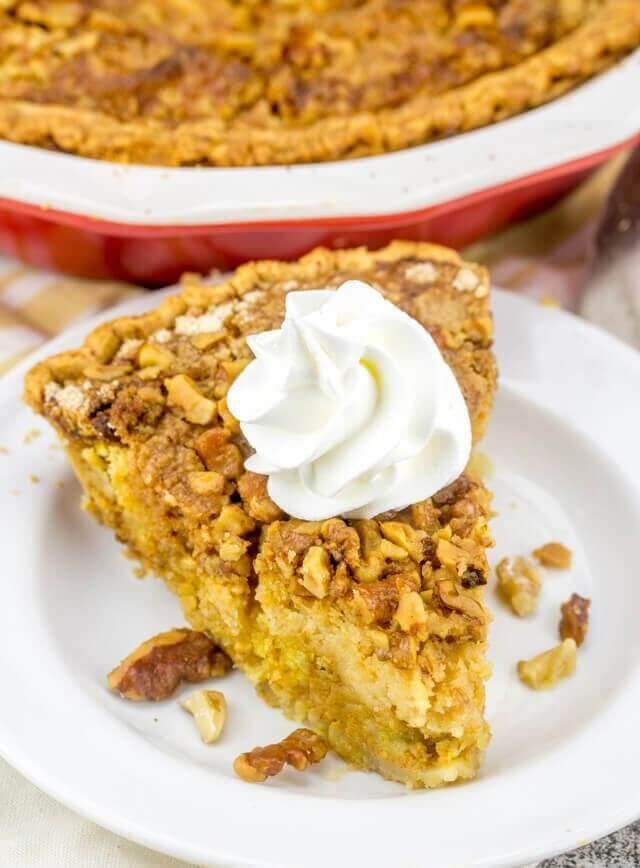 Pumpkin Crumb Pie has a traditional pumpkin pie base, with a cake mix and nut crunch streusel baked on top. This easy pumpkin recipe makes the perfect fall dessert! pumpkin dump cake pie