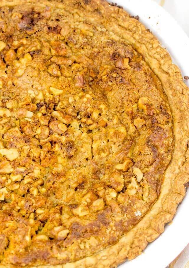 Pumpkin Crumb Pie has a traditional pumpkin pie base, with a cake mix and nut crunch streusel baked on top. This easy pumpkin recipe makes the perfect fall dessert! pumpkin pie with a nut crunch streusel topping