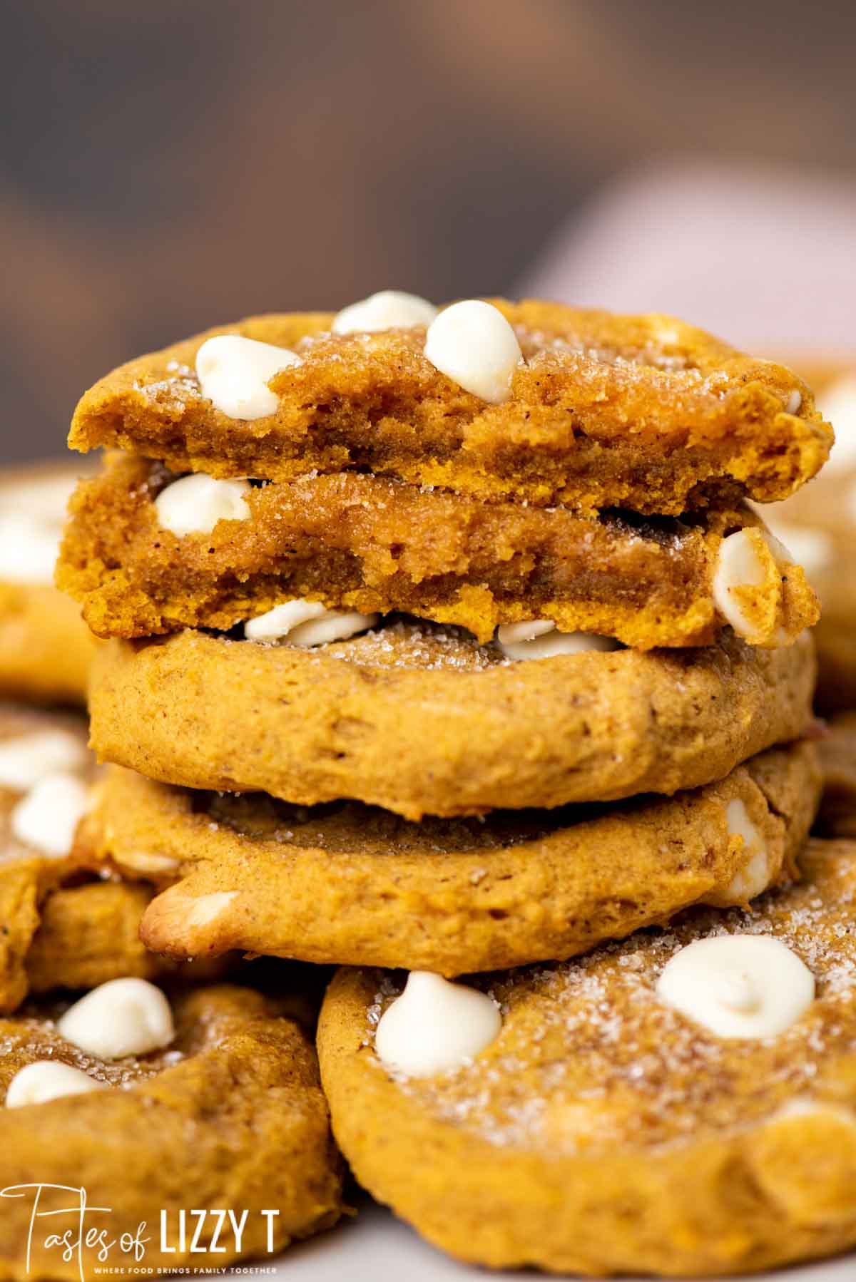 stack of pumpkin cookies, one broken in half