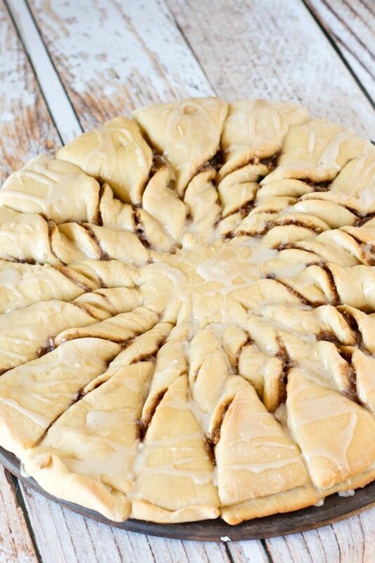 Impress your friends with these Maple Nut Cinnamon Twists. Sweet dough is filled with a brown sugar, cinnamon-nut spread and drizzled with maple glaze.