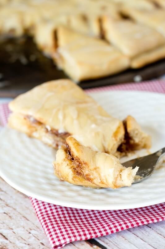 Impress your friends with these Maple Nut Cinnamon Twists. Sweet dough is filled with a brown sugar, cinnamon-nut spread and drizzled with maple glaze.
