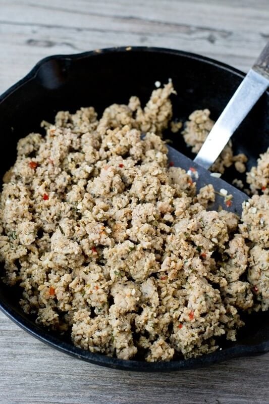 browned italian sausage in a skillet