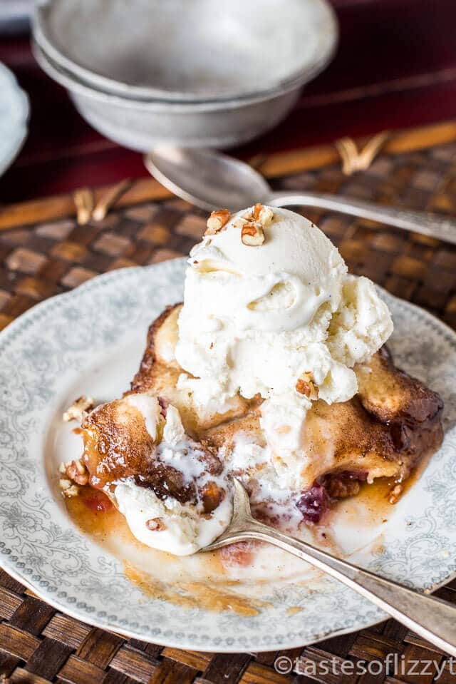 Whole cranberry sauce gives traditional apple dumplings a holiday tanginess. Serve these Amish Cranberry Apple Dumplings with a scoop of vanilla ice cream on top! A simple dough is wrapped around apple slices and cranberry sauce, then baked in a brown sugar syrup. slice of cranberry apple pie ala mode