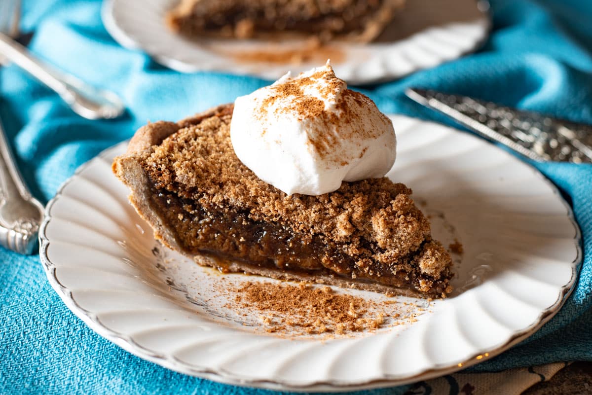 a piece of molasses pie sitting on a plate