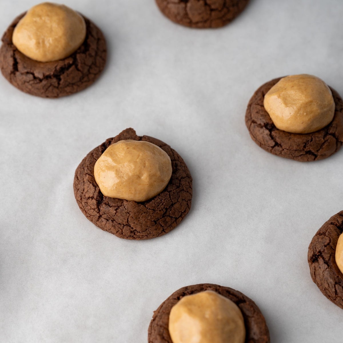 chocolate cookies with a peanut butter ball on top