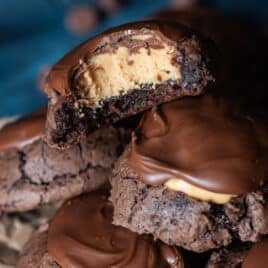 buckeye brownie cookies in a pile, one with a bite out