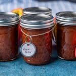 apple butter in jars on a table