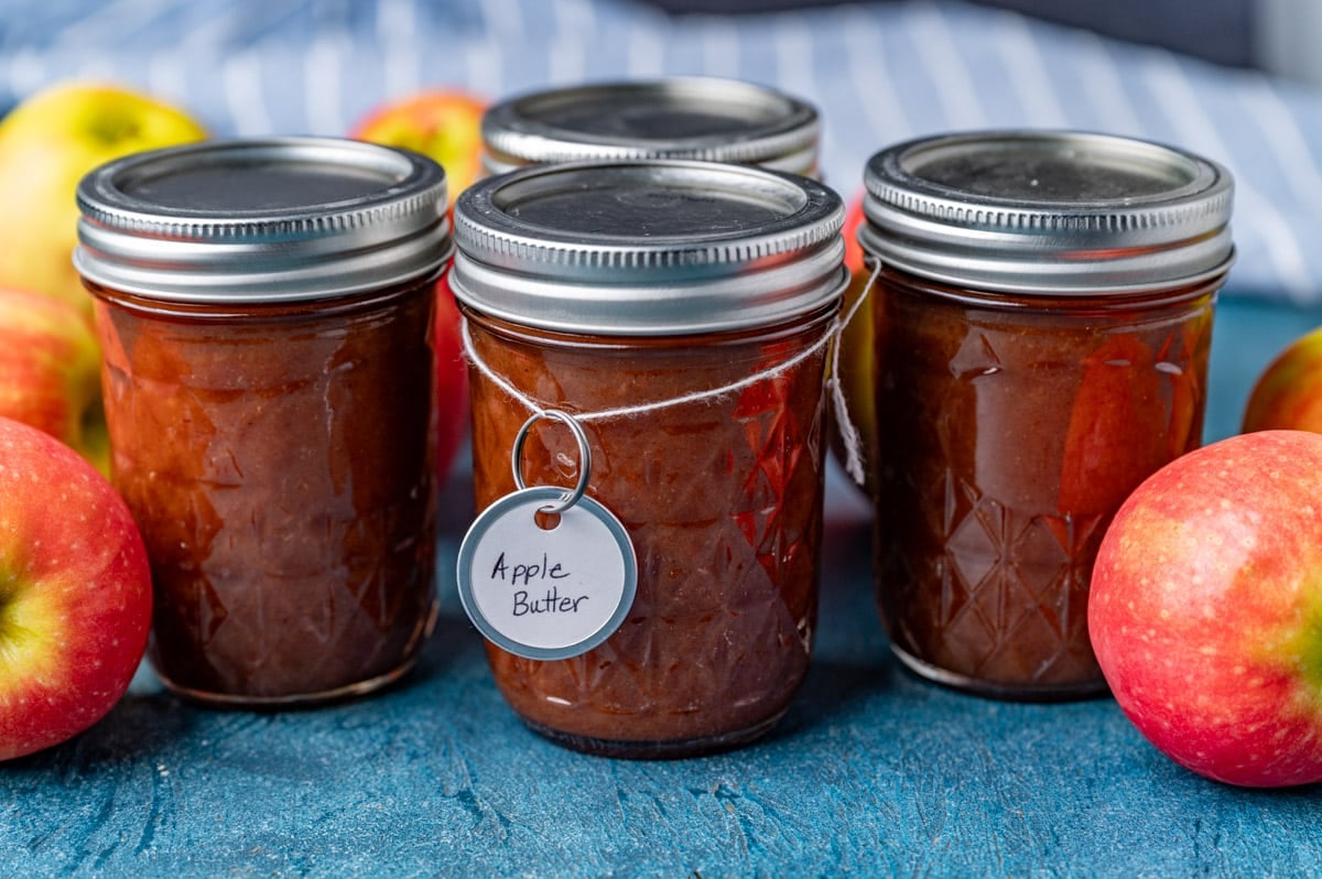 apple butter in jars on a table