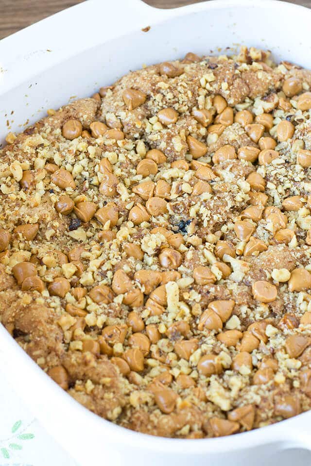 Butterscotch Apple Snack Cake baking dish full of homemade apple cake with butterscotch chips