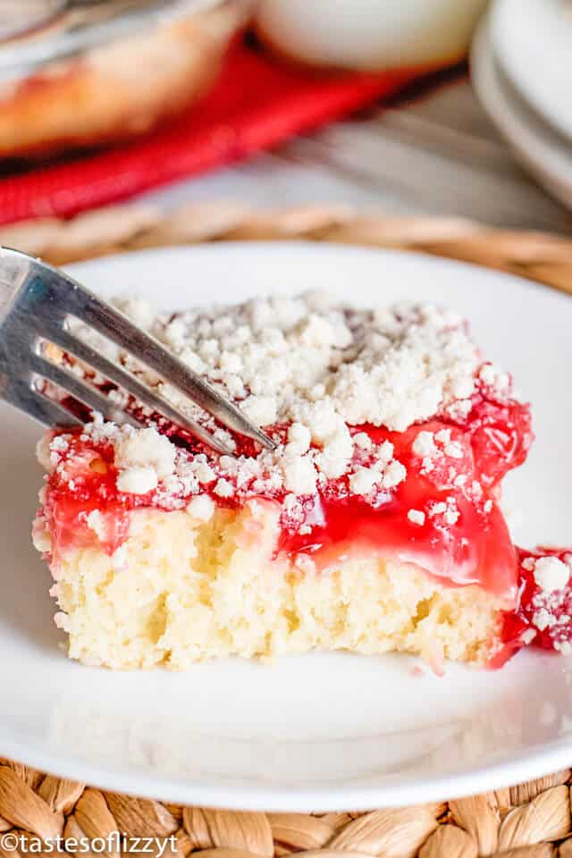 cherry coffee cake on a plate with a fork