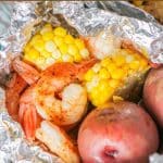 Whether you are camping or cooking at home, these easy grilled shrimp foil packets with fresh corn and potatoes are a quick 30 minute dinner recipe.Â