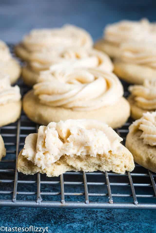 Frosted Eggnog Cookies are made with a soft sugar cookie recipe that's spiked with eggnog. The soft eggnog cookies have a swirl of eggnog frosting on top. #christmascookies #eggnog #recipes soft frosted sugar cookies spiked with eggnog