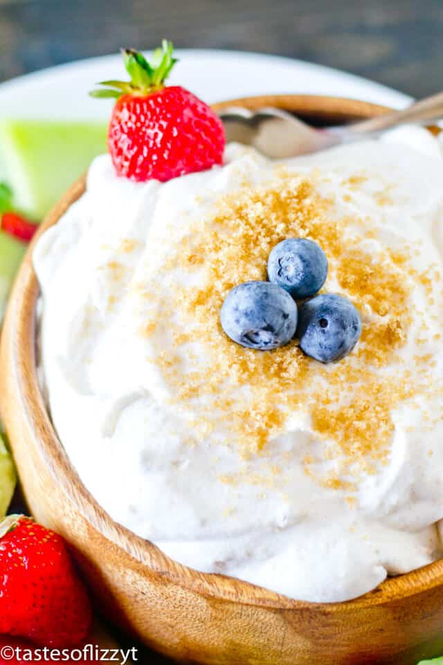 A close up of fluffy fruit dip with brown sugar