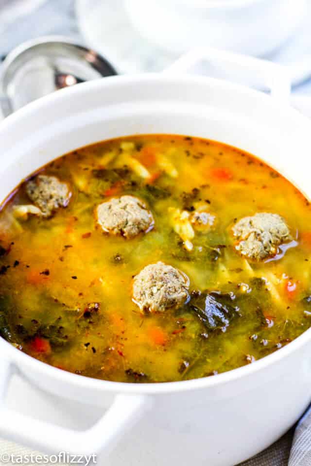 Albondigas soup is a delicious Mexican meatball soup with homemade meatballs. This traditional Mexican soup recipe makes a fantastic and easy Cinco de Mayo meal! large white pot of Mexican meatball soup