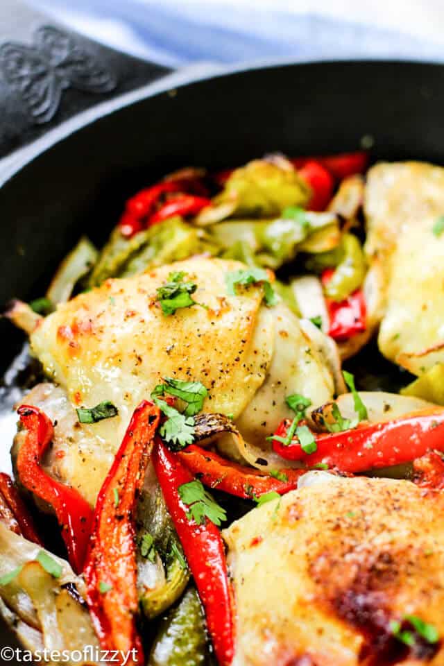 Italian Chicken Skillet is one of our favorite chicken skillet recipes. Chicken thighs with an Italian dressing marinade, oven-baked to juicy perfection. #skilletmeals #chickenrecipes #Italianchicken chicken thighs marinated in Italian dressing cooking in a skillet