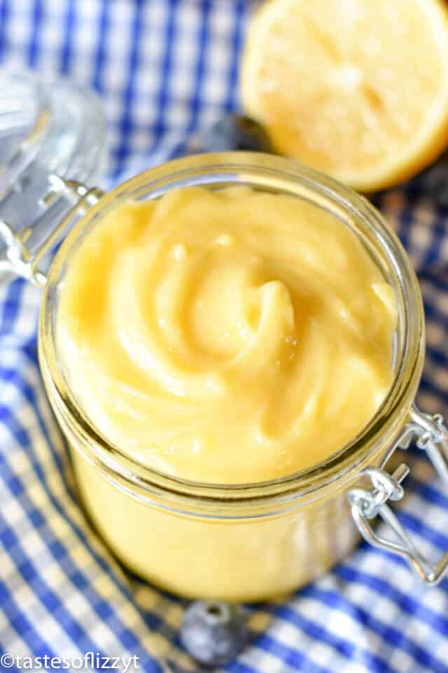 This lemon curd recipe is quick and easy to make and the sweet lemon condiment is so versatile! You can use it to make lemon desserts, or enjoy it for breakfast! It's delicious on toast, biscuits, pancakes, and more! jar of homemade lemon curd