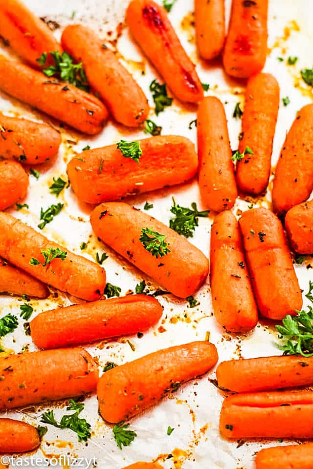 Oven roasted carrots are a delicious, healthy side dish, perfect for serving with a holiday meal. This easy side dish recipe makes tender baby carrots with a sweet honey glaze. They are simply irresistible! holiday side dish of roasted carrots