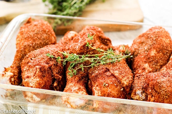 seasoned drumsticks in a baking dish