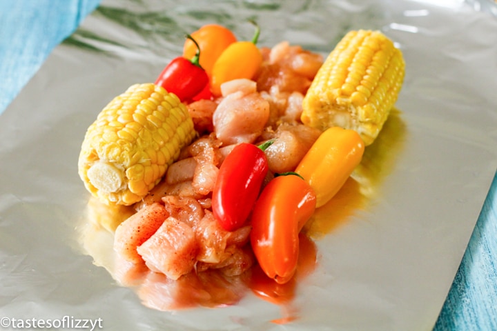 veggies and chicken on a piece of foil