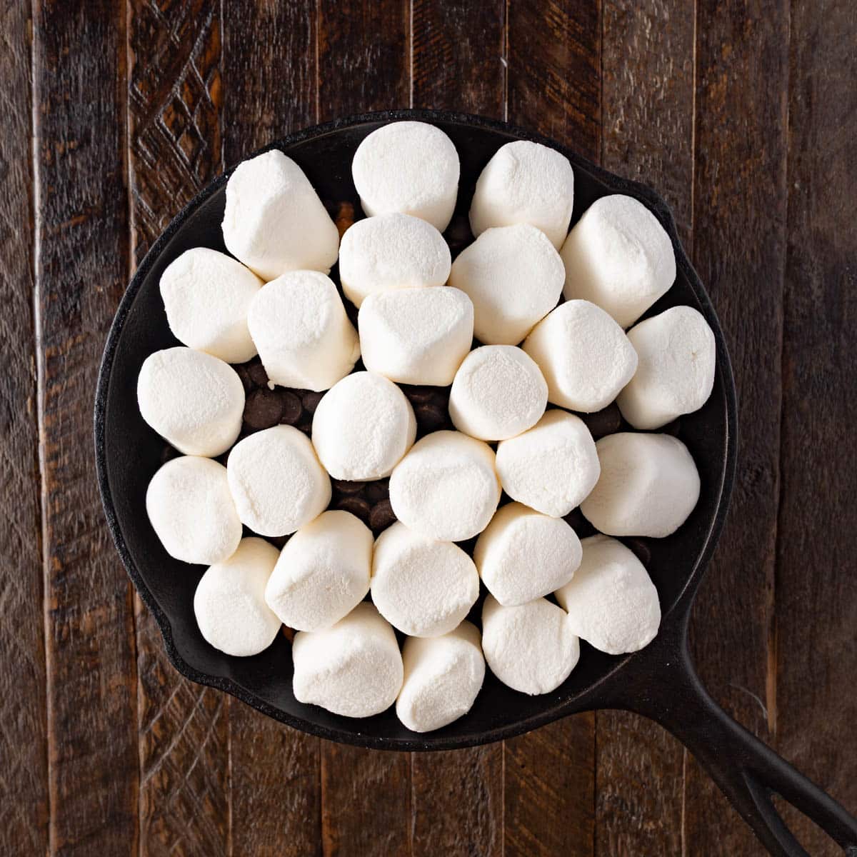 unbaked s'mores dip with marshmallows on top