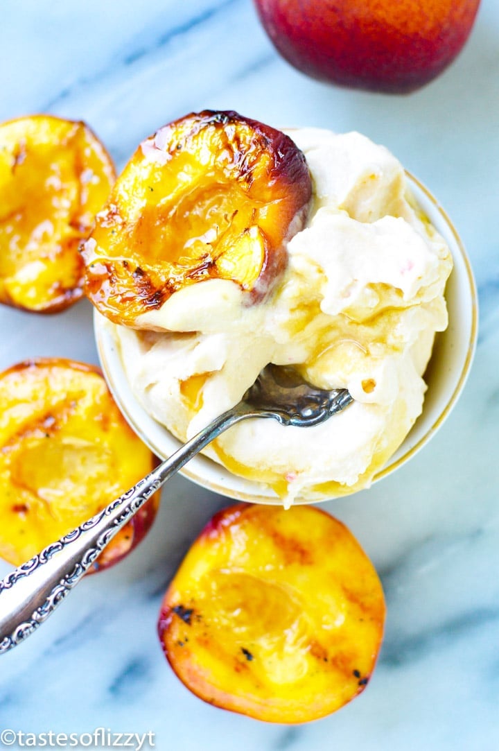 a bowl of ice cream with peach