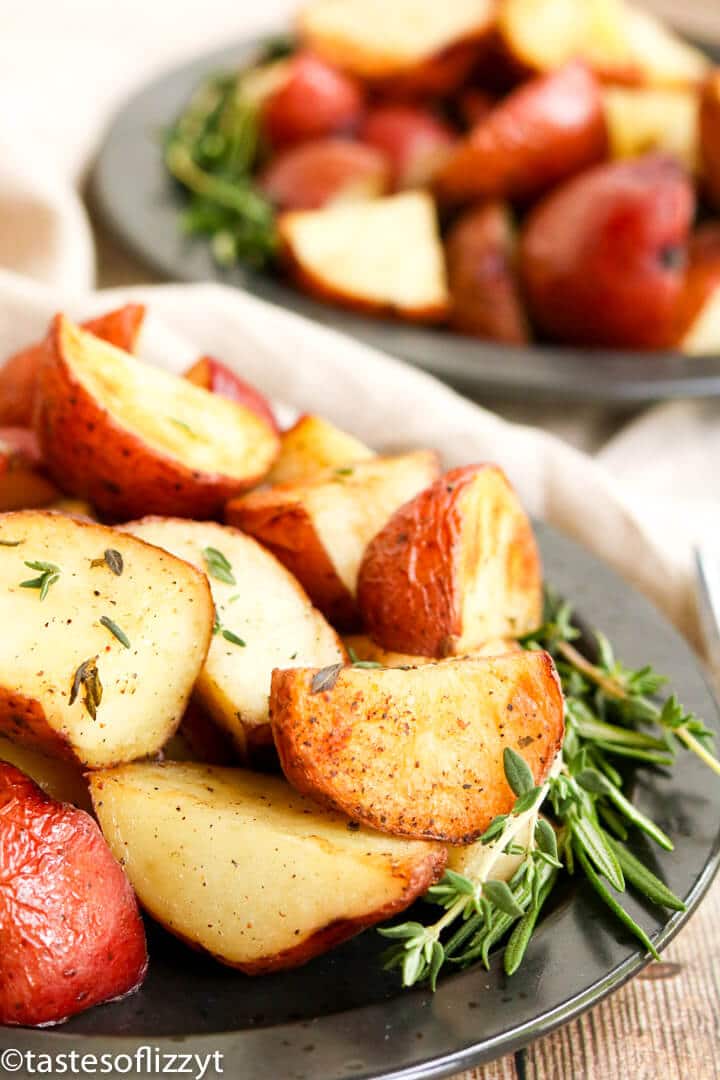 A plate of food, with roasted potatoes