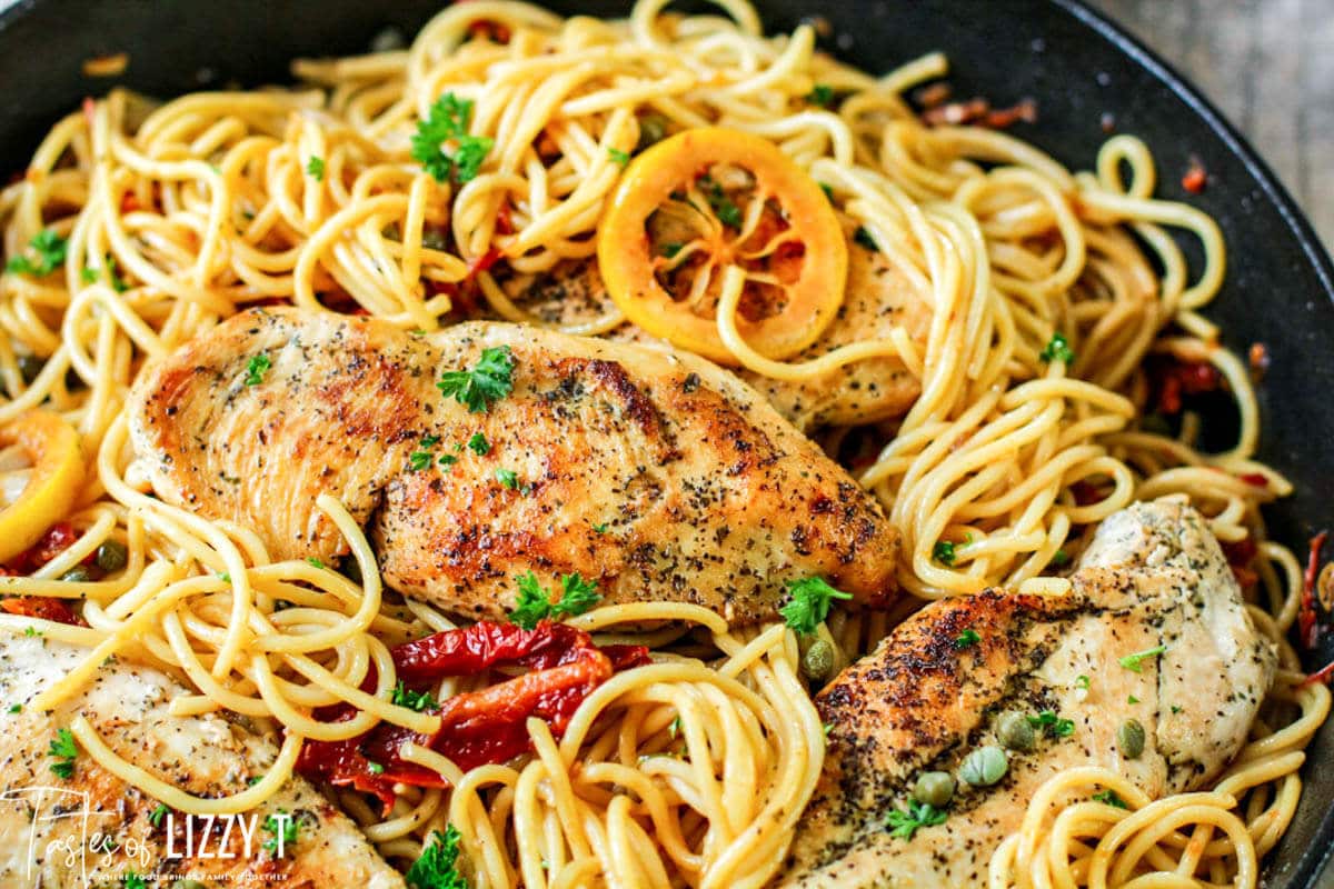 chicken piccata with sun dried tomatoes in a skillet