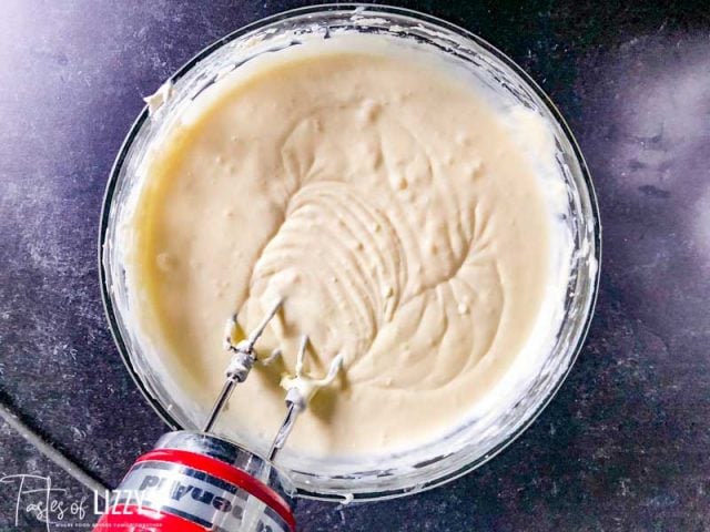 A close up of a glass bowl, with Cheesecake batter