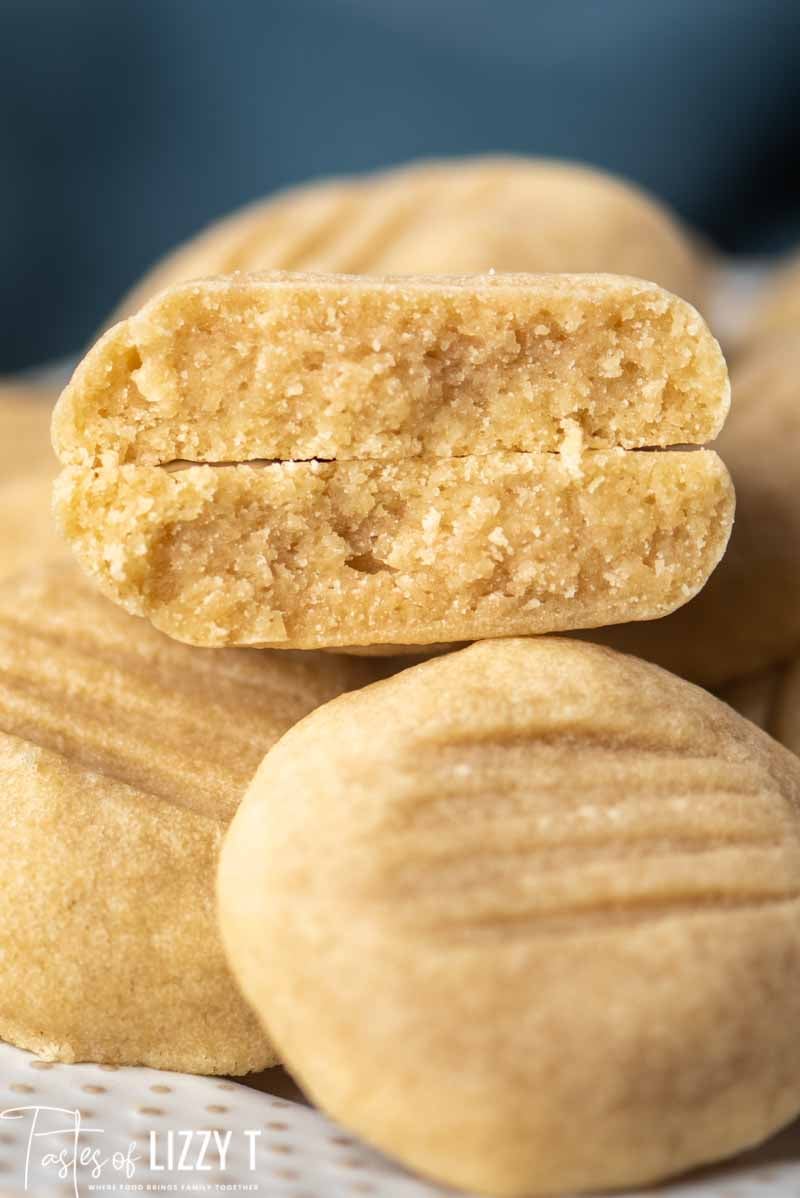 A close up of a butter cookie broken in half