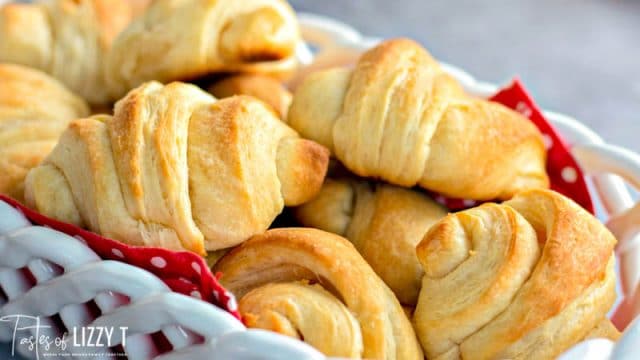 horizontal image of a basket of crescent rolls