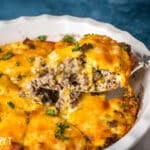 a spatula pulling out a piece of cheeseburger pie