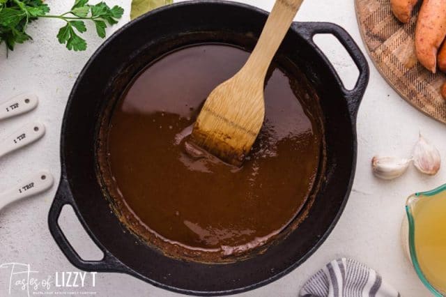 brown sausage in a cast iron skillet
