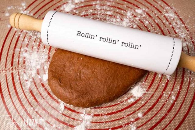 rolling pin on a mat with chocolate dough
