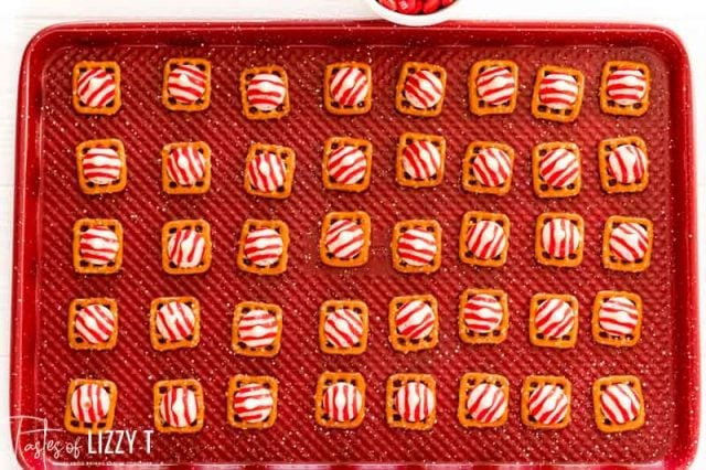 hershey kisses sitting on top of waffle pretzel