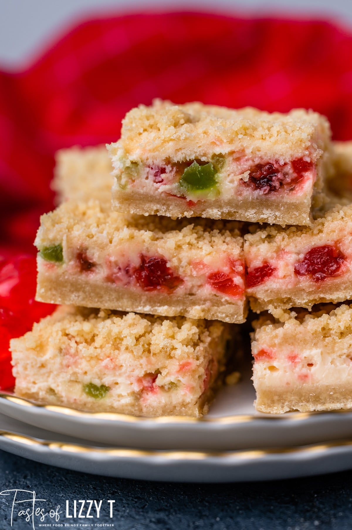 stack of merry cherry cheesecake bars on a plate