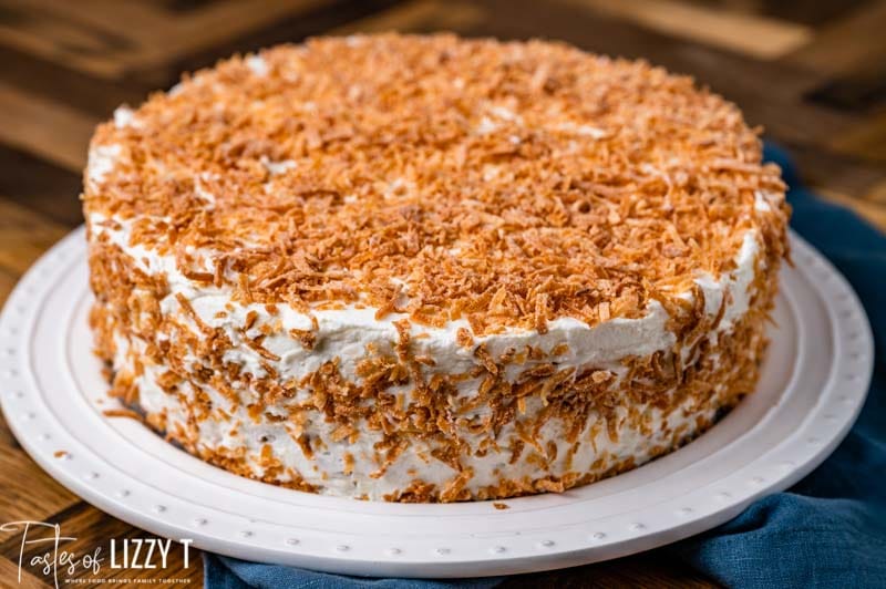 toasted coconut tres leches cake on a plate
