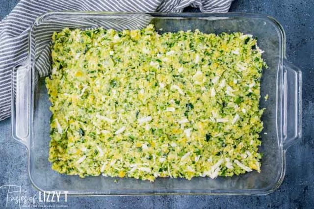 unbaked zucchini pizza crust in a pan