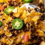 a spatula serving up baked nachos