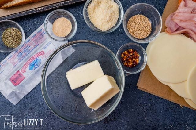 stick of butter cut in half in a mixing bowl