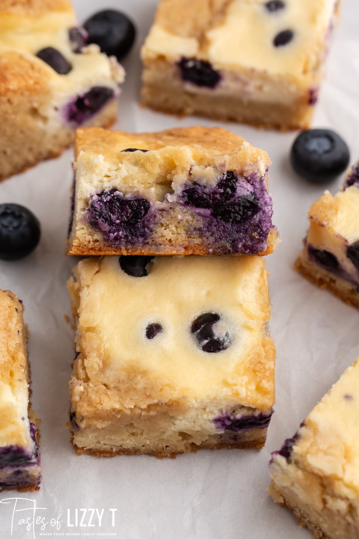 blueberry cheesecake blondies bars on a table