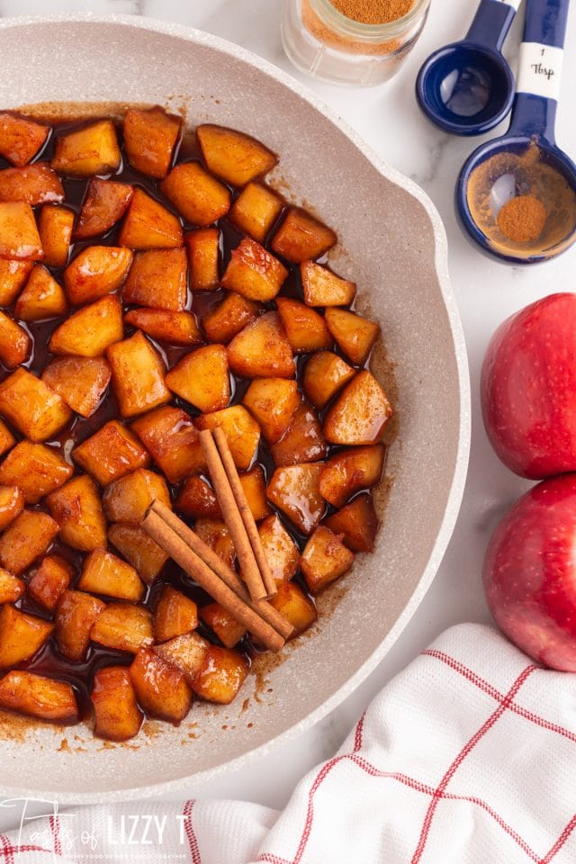 fried apples on a table in a skillet