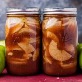 two mason jars of apple pie flling