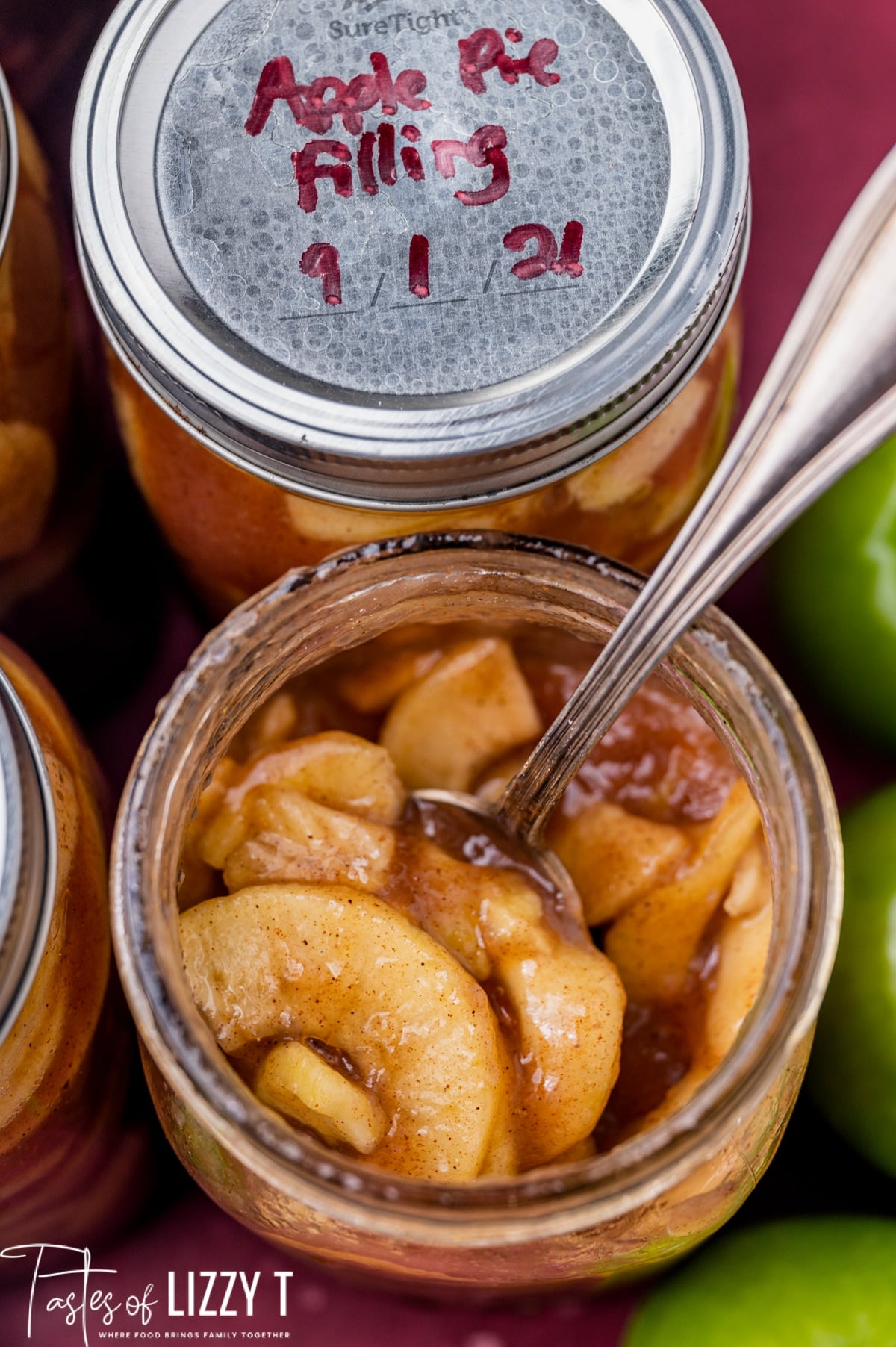 two jars of apple pie filling, one closed and one open