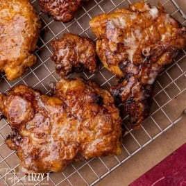 closeup of fried chicken on a wire rack
