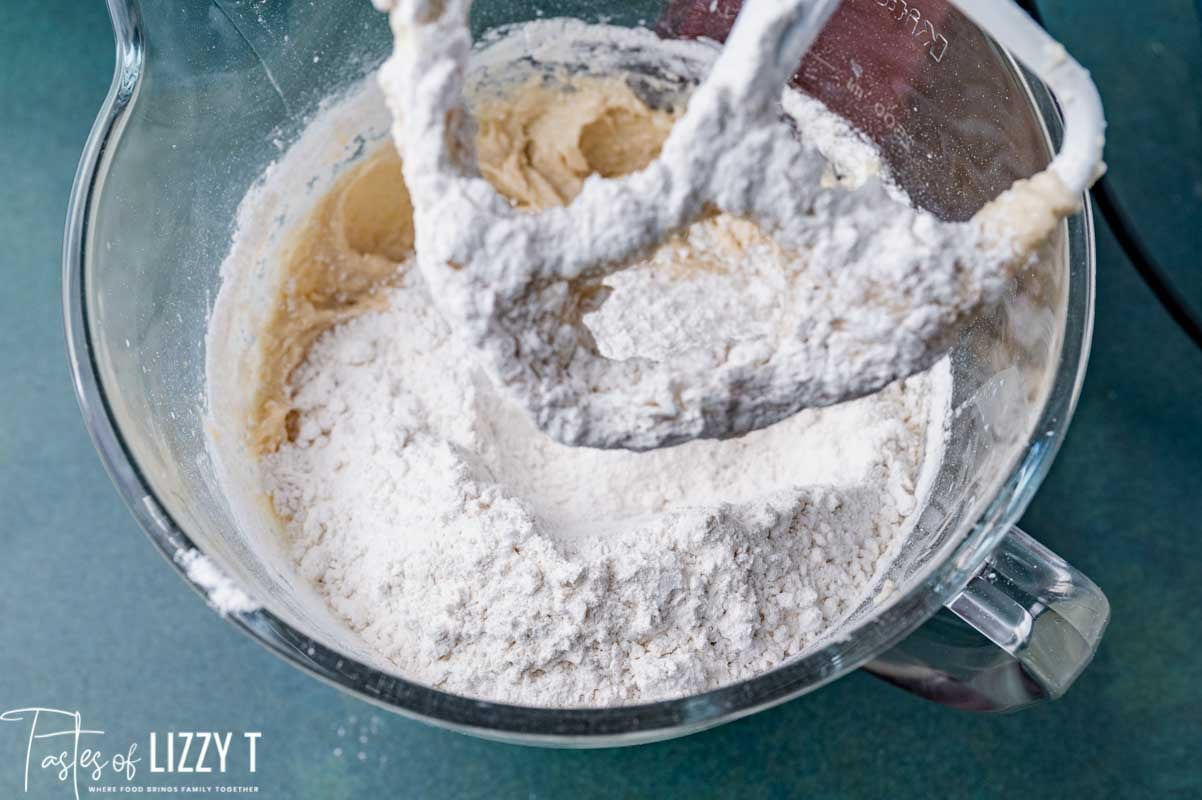 flour over wet ingredients in a mixing bowl