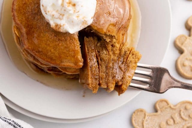 overhead view of a bite of pancakes on a fork