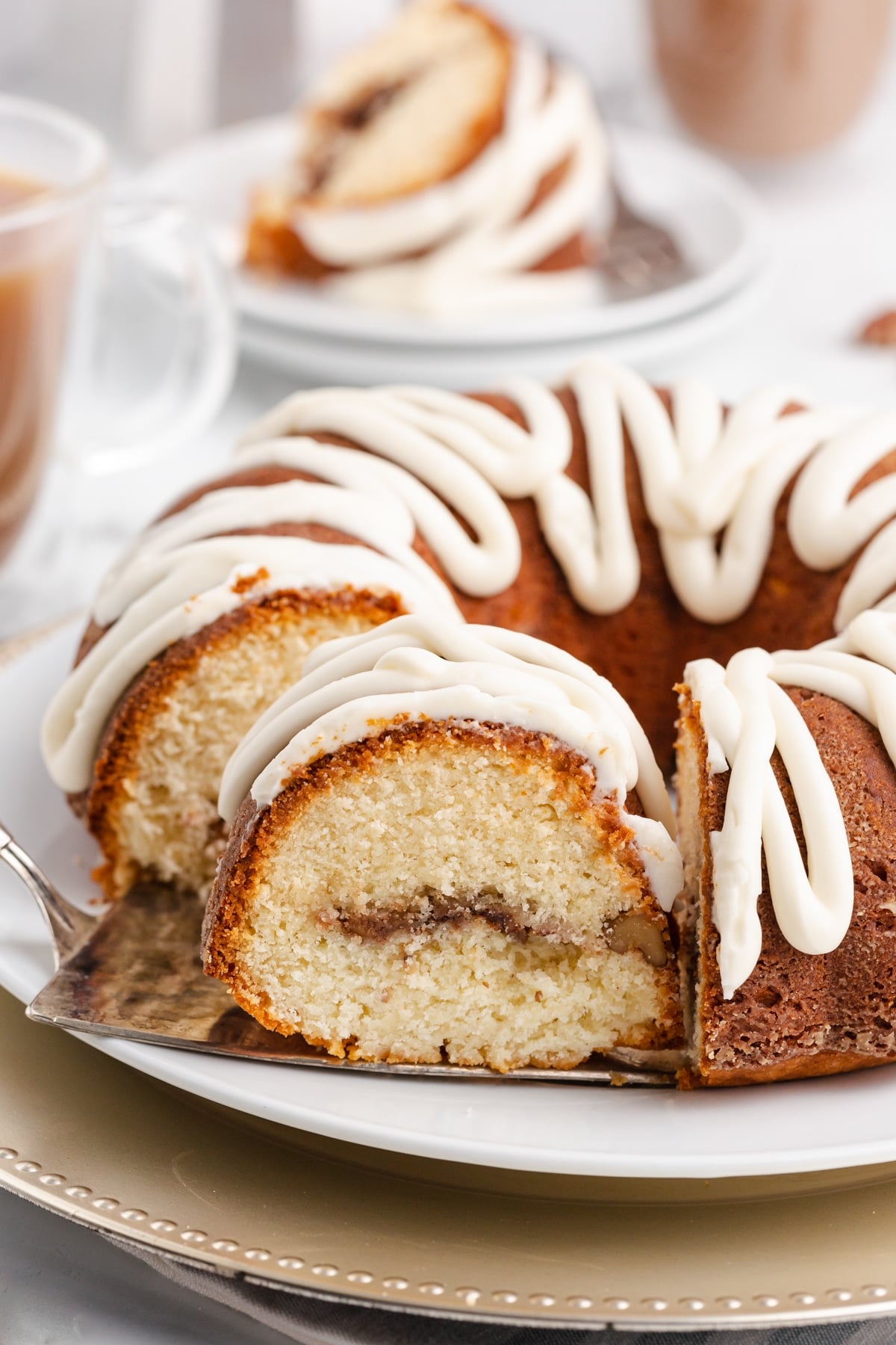 a bundt cake on a table with coffee
