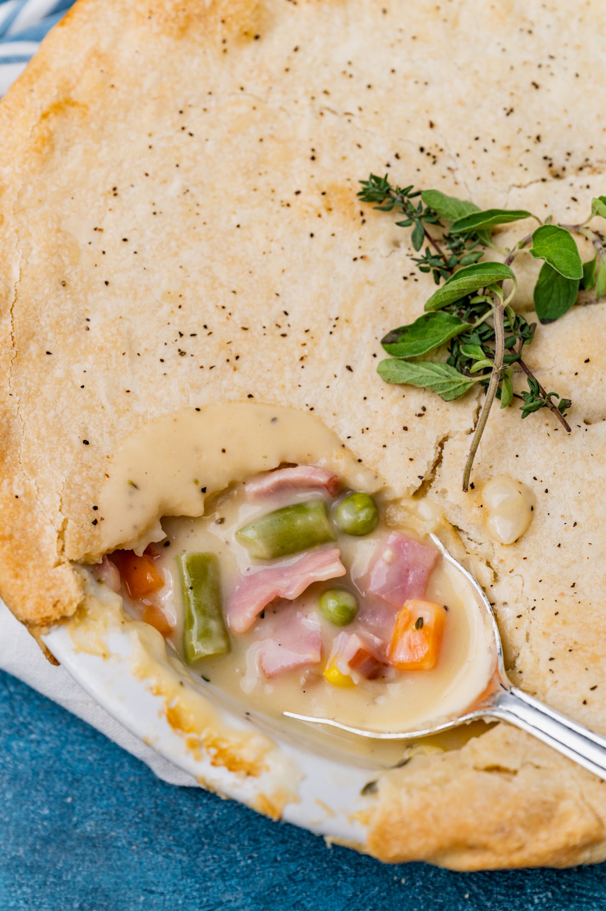 overhead shot of ham pot pie with a spoon