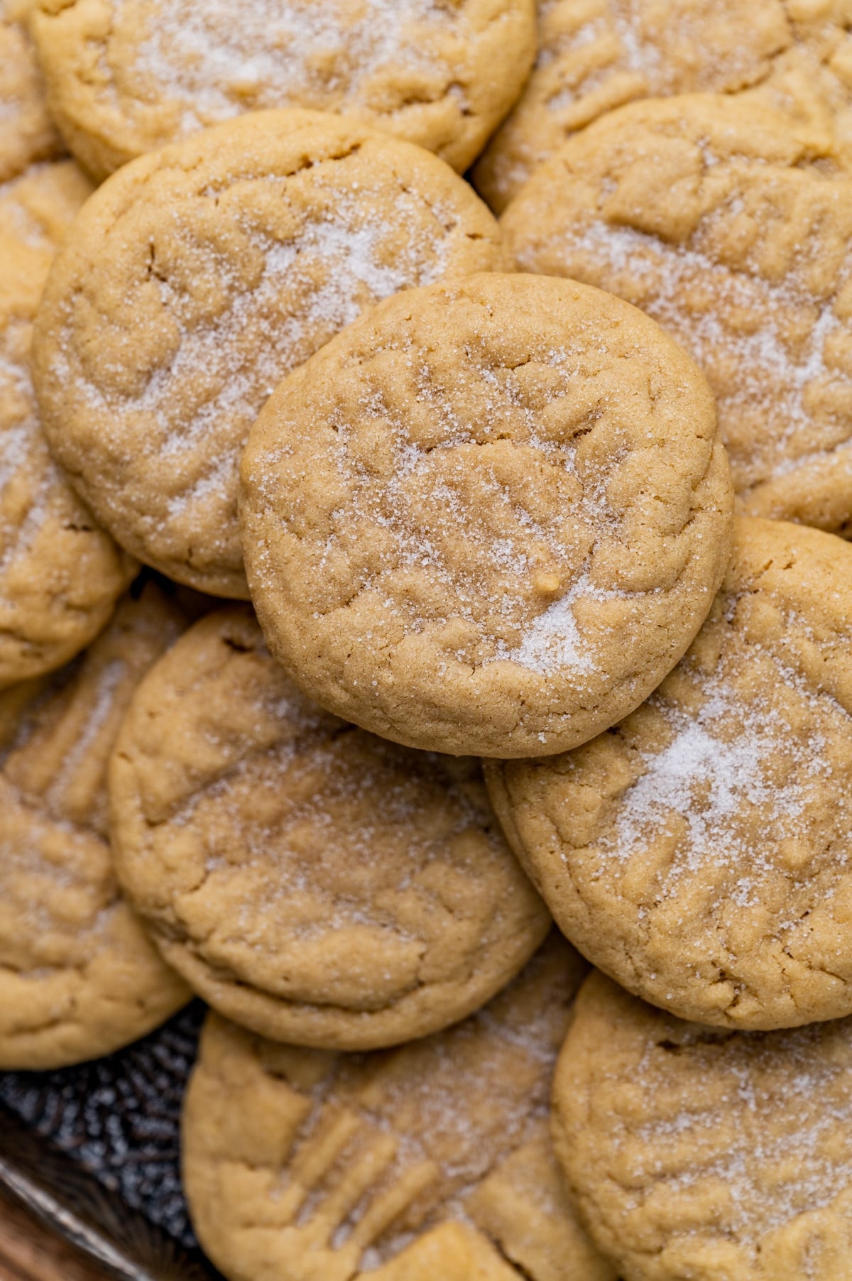 a pile of peanut butter cookies topped with sugar